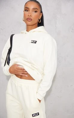PRETTYLITTLETHING Logo Cream Badge Detail Oversized Hoodie